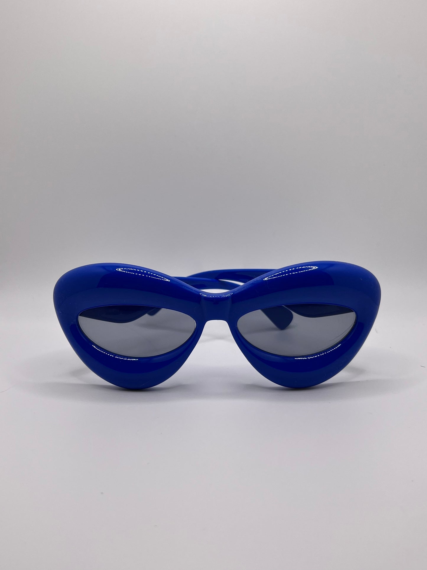 These inflated sunglasses in blue are giving effortless icon. Try them in every color and add a splash of extra to any outfit. These work for formal events or a day of errands and will make you feel glam every step of the way.