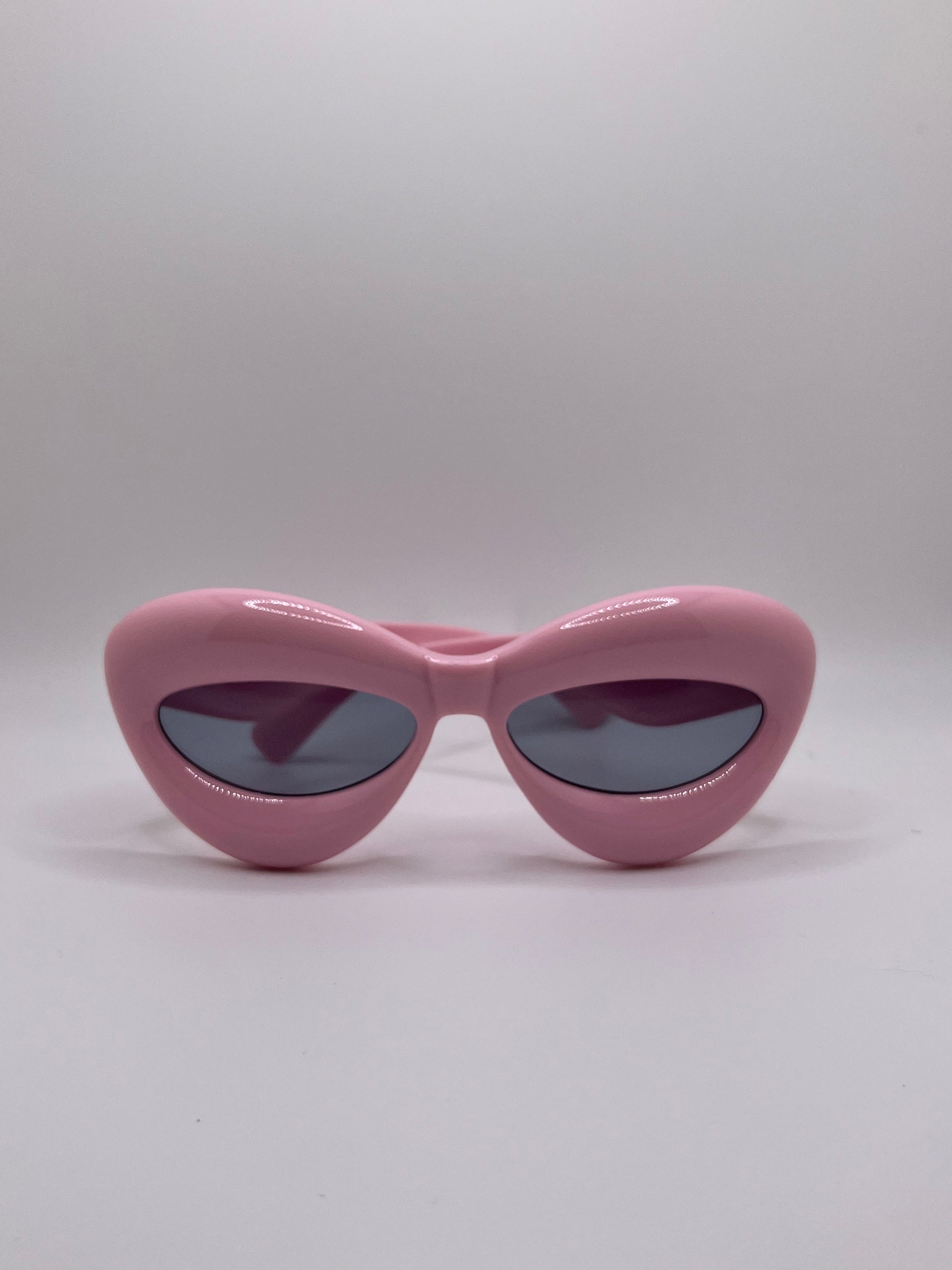 These inflated sunglasses in pink are giving effortless icon. Try them in every color and add a splash of extra to any outfit. These work for formal events or a day of errands and will make you feel glam every step of the way.