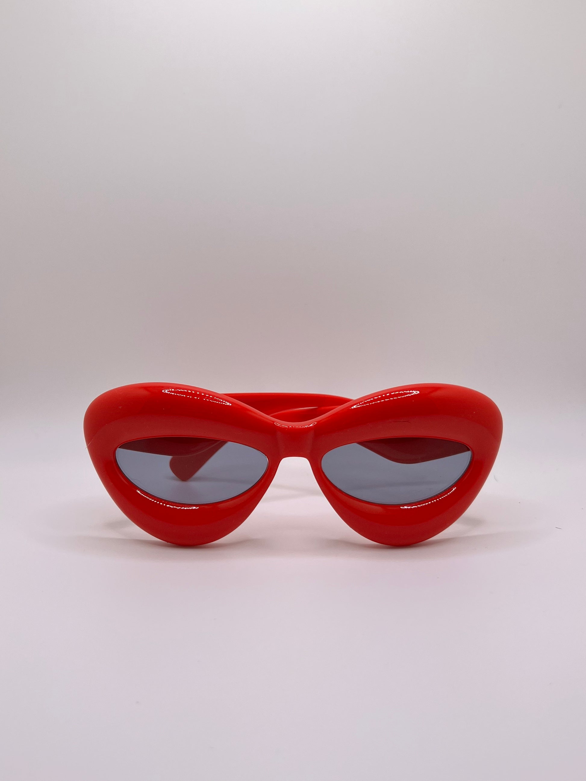 These inflated sunglasses in red are giving effortless icon. Try them in every color and add a splash of extra to any outfit. These work for formal events or a day of errands and will make you feel glam every step of the way.