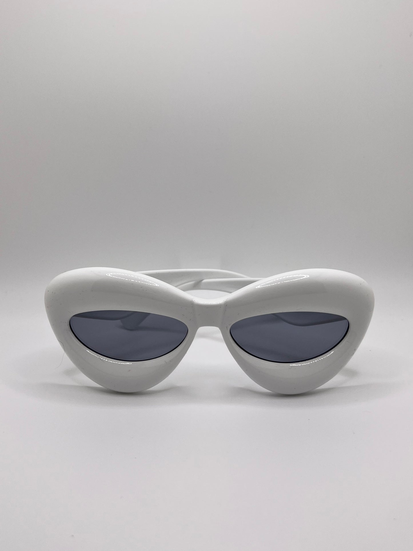 These inflated sunglasses in white are giving effortless icon. Try them in every color and add a splash of extra to any outfit. These work for formal events or a day of errands and will make you feel glam every step of the way.